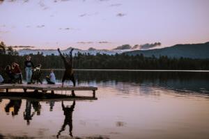 Paul Smith's student doing handstand on the dock